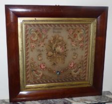 A Victorian woolwork sampler embroidered with flowers by Hannah Barron, work 1847 with original