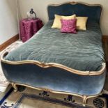 A Louis XV revival gilt double bed, serpentine headboard and footboard raised on scrolling