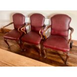 A set of seven mahogany and leather Gainsborough revival chairs, brass stud framed, cartouche shaped