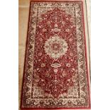 A Middle Eastern revival wool rug, made by Imperial Jewel, Kohinoor Belgium. 67cm H x 130cm W ***
