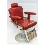 A Belmont Barber's chair, circa 1950s, upholstered in red with chrome detail