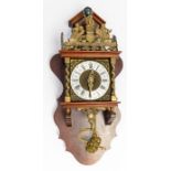 A reproduction German 20th century wall clock, brass figural finial, circular silvered dial