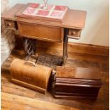 An early 20th century Singer sewing machine workstation; another Singer; another similar (3) ***