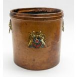 A 19th century tan leather bucket, painted with British Coat of Arms, lion mask ring handles,