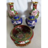 A group of modern cloisonné vases and a bowl on wooden stands damage to one of the wooden stands.