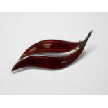 Aksel Holmsen - A Norwegian silver and red enamel brooch, in the form of a leaf, stamped Norway