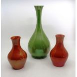 A pair of Moorcroft orange lustre vases 14cm high and a Moorcroft green lustre vase 26cm high good