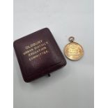 A 9ct gold hallmarked Attendance medal from Oldbury Urban District Education Committee in case.