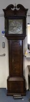 An 18th century oak longcase clock, the hood with swan neck pediments and carved wooden paterae,