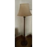 A 20th Century oak standing lamp. ***Offsite Location***