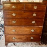 A George III revival mahogany chest on chest, slight over-sailing top above two short and two long