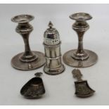 Pair of weighted silver candlesticks Birmingham indistinct year mark ,  Silver sugar sifter with