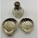 2 silver shell shaped dishes London 1912 and Sheffield 1903 66 grams and a silver top scent bottle