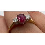 An 18ct gold ruby and diamond ring. Approximate gross weight 2.7 grams. Estimated diamond weight 0.