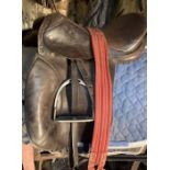 16” leather saddle complete with stirrups and girth.