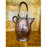 A Victorian copper and brass baluster shaped water carrier with lid and loop swing handle. 50cm high