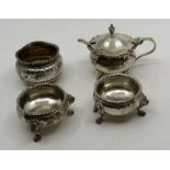 Pair of silver salts London 1905 , a single salt with gilt interior London 1877 and a mustard pot