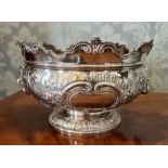 A Sterling silver embossed monteith bowl by C S Harris & Sons Ltd, with fluted and floral decoration