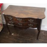 A Dutch walnut serpentine fronted two drawer side table, late 18th Century, with dipped apron on