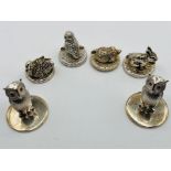 A selection of weighted animal themed card holders in sterling silver. To include a pair of owls,