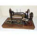A Frister and Rosman Antique sewing machine and case C 1870 serial number is on needle arm lockable
