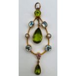 A peridot, seed pearl and gem set early 20th century pendant. Unmarked. 5.2 grams.