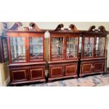 Three matching Chippendale influence display cabinets, scrolling broken pediment on a dental
