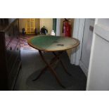 A Victorian oak folding card table circa 1880, circular with green baize lined playing surface,