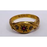 An 18ct gold gypsy set ruby and diamond ring. Approximate gross weight 2.3 grams. Size P.