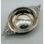 Sterling silver quiach, with pierced handles featuring faces, hallmarked 1897 for London, sponsor