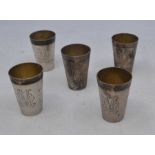 A set of five German silver shot tumblers, by Julius Herz, circa 1900, each with engraved OM