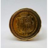 An 1872 half sovereign set in a 9ct gold signet ring. Gross weight approximately 10.5 grams. Size U.