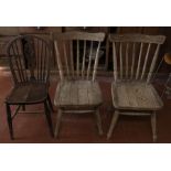 A set of four oak ‘water’ bleached stick back kitchen chairs, 20th Century, with bowed top rails and