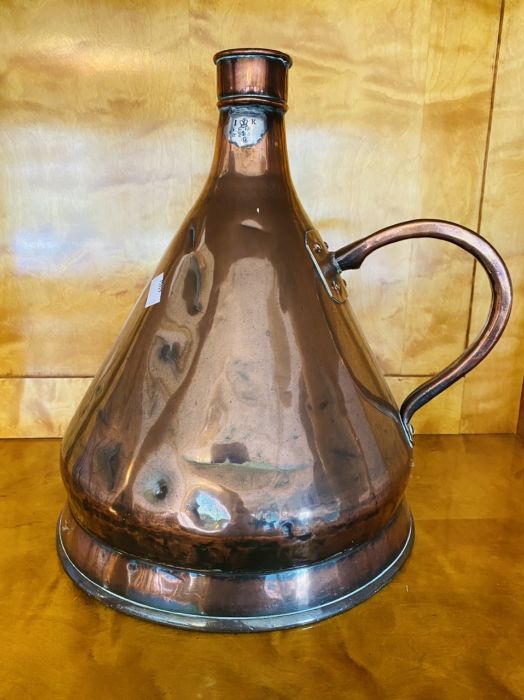 A Victorian conical copper 2 gallon measure with loop handle, 40cm high condition: some denting to