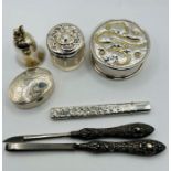 A selection of sterling silver items - comprising a silver handled pair of cosmetics tools, a silver