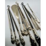 An interesting collection of 11 silver handled button hooks (11)