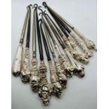 A selection of silver handled button hooks - with a variety of ornamental handles - 12 in number.