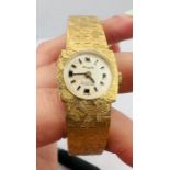 A yellow metal Orofa textured watch, stamped 585. Untested. Approximate weight 37 grams. Unused.