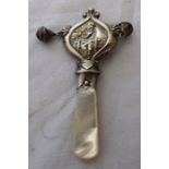 An Edwardian silver and mother of pearl baby rattle, Birmingham .C 1905, With a boy blue design