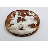 A shell cameo depicting Aurora, goddess of the dawn, driving her two horse chariot through the