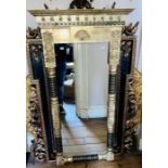 A Victorian revival Thai made gilt mirror, scrolling carved pediment flanked turned finials, on a