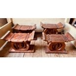 A set of four 20th century African Ghanese carved hardwood stools. (4)