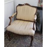 French walnut open armchair in Louis XVI style, early 20th Century, with striped cream upholstery on