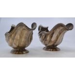 A pair of George II silver sauce boats, London 1743 by Robert Brown, each of scrolling shell