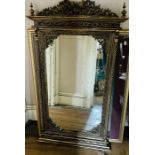 An American version of a William Kent Tabernacle gilt mirror, moulded top over a beaded frieze and