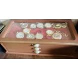 A 20th century pocket watch collectors chest, with various pocket watches including Quartz, Sekonda,