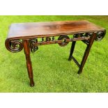 A Chinese hardwood side table, c1900, the plain top with pierced scroll ends, similar apron,