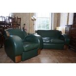 An Art Deco wood framed three piece suite upholstered in green leather comprising two seat sofa