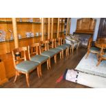 A set of twelve satin birch and ebonized Biedermeier style dining chairs with gilt metal mounts, the