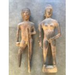 A pair of early 20th century carved wooden figures of a naked man and woman. (lot as found), height: